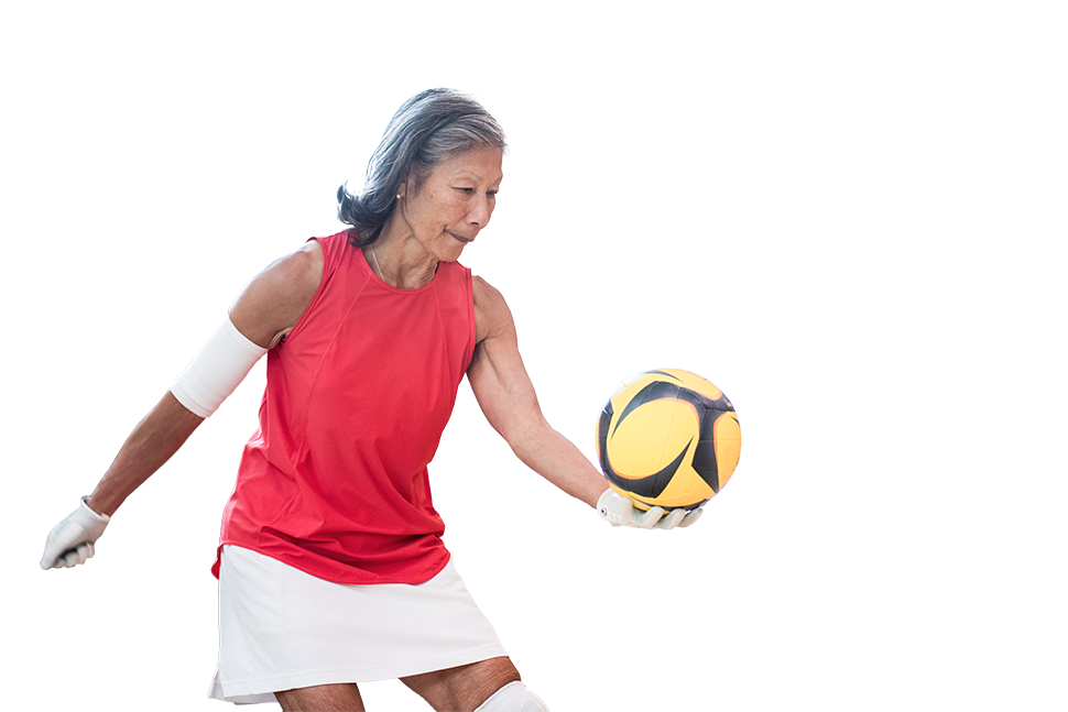 Photo of an adult serving in a volleyball game.