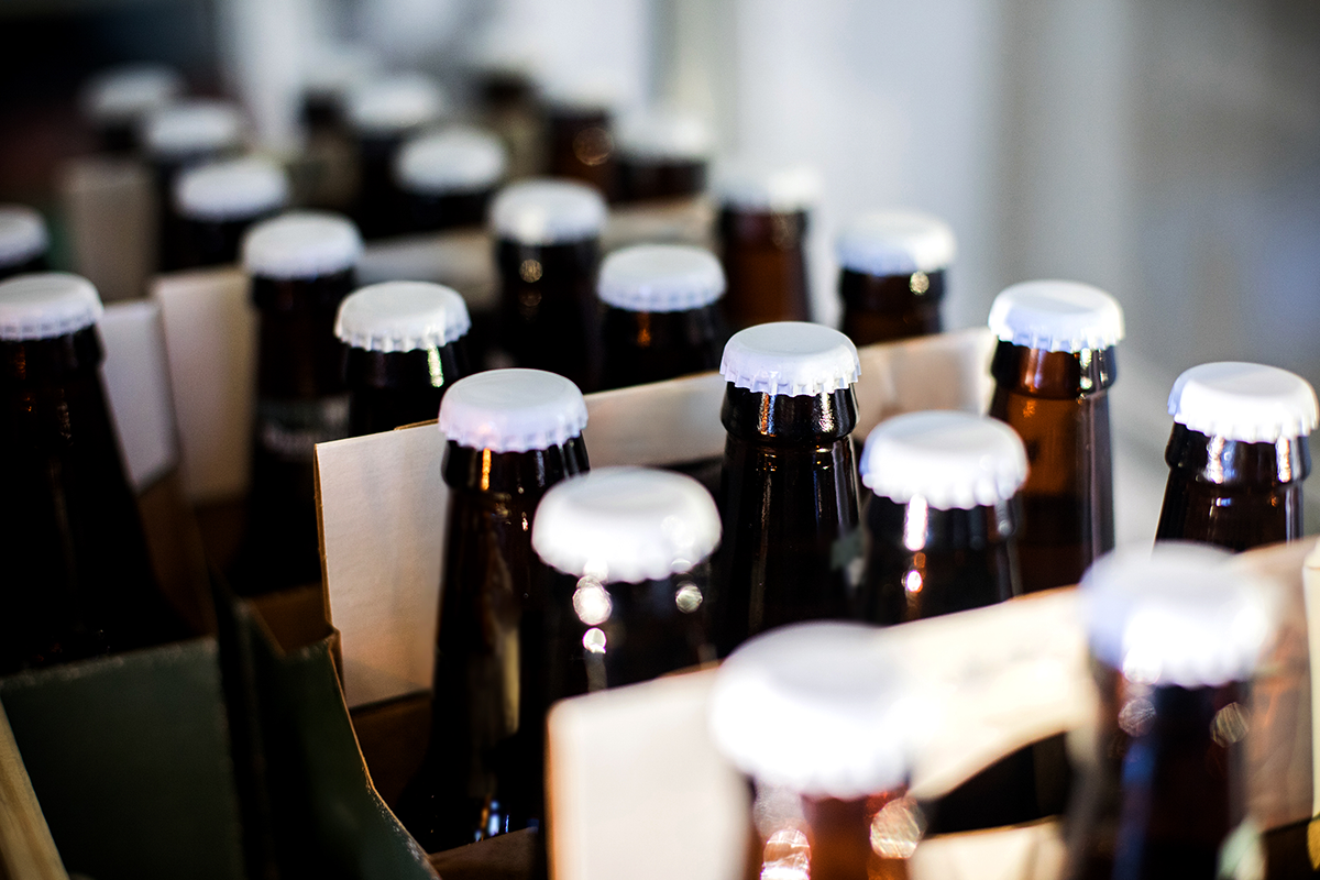 Photo of beer bottles inside of a fridge at a brewery bottle shop in Toronto.