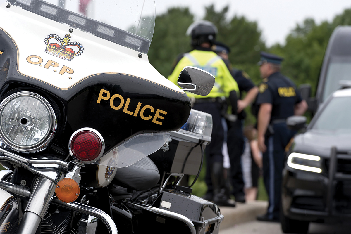 Photo of the Ontario Provincial Police motorcycle and officers.